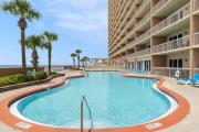 Tropical-themed 17th-floor condo with beachfront views pools & gym