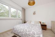Spacious Air-Conditioned Apartment with Workspace by Noclegi Renters
