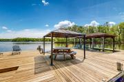 Lakefront home with two kitchens, a dock, firepit, & pontoon