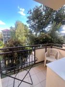 Sunny 1-room apartment with a balcony and parking in the city center
