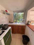 A bright little house in a central location with a wood-burning stove