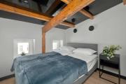 Modern Attic Apartment with Air Conditioning in the City Centre by Noclegi Renters