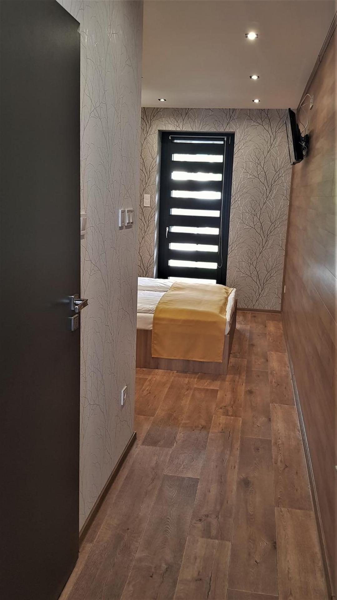 Erdőalja 11 Apartman