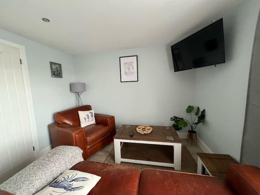 Orchard Lodge -Coastal Retreat, new build, village views, private garden and terrace