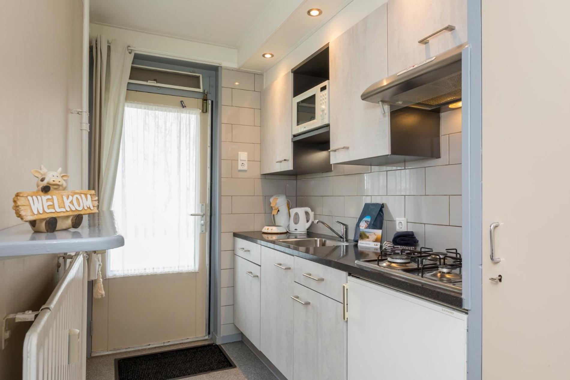 Welcome in - Appartement dichtbij het strand, met fietsenberging en ruim terras