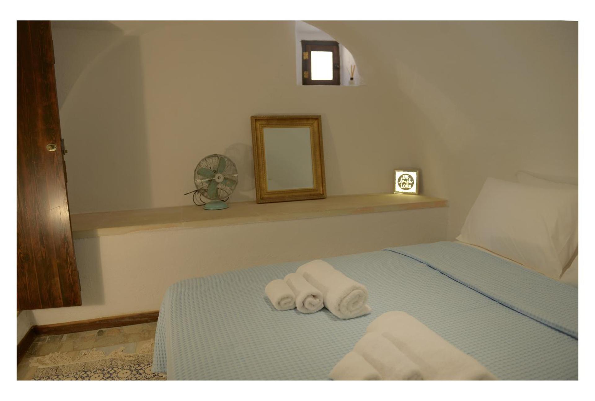 NEFELI castle stone house inside the fortress