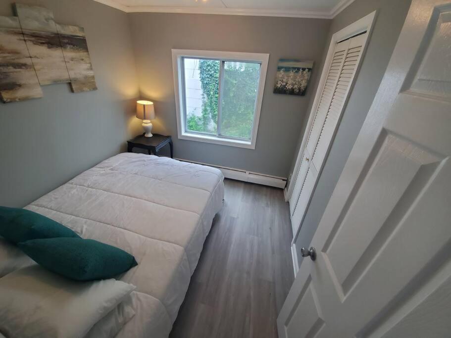 Beachy Bay Breeze Bungalow 2BR with parking and close to many amenities.