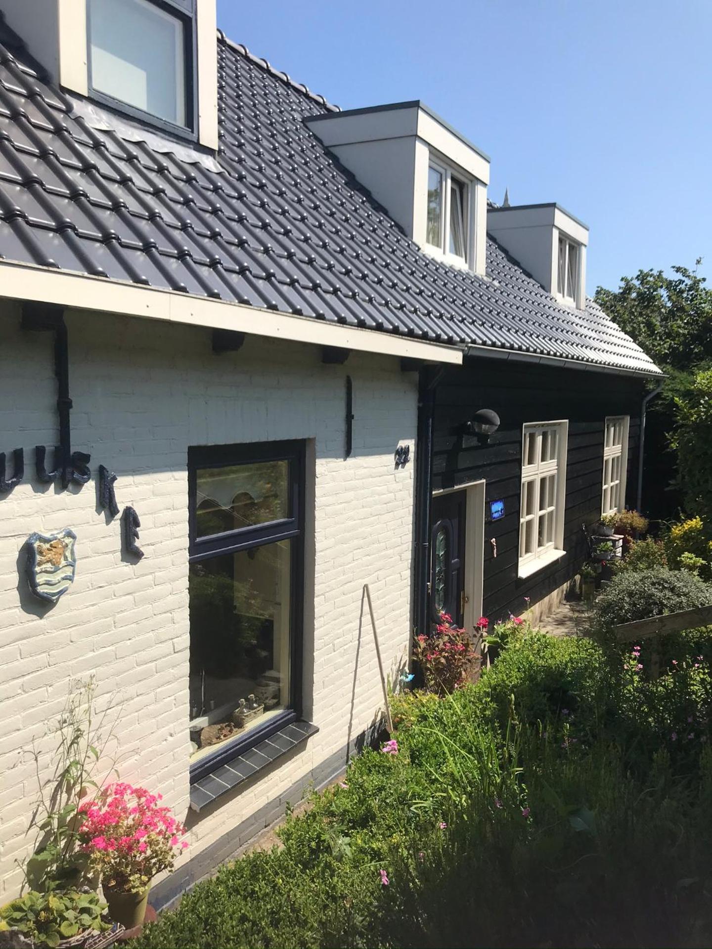 T Huuske tuinappartement met fantastisch uitzicht, nabij Zee