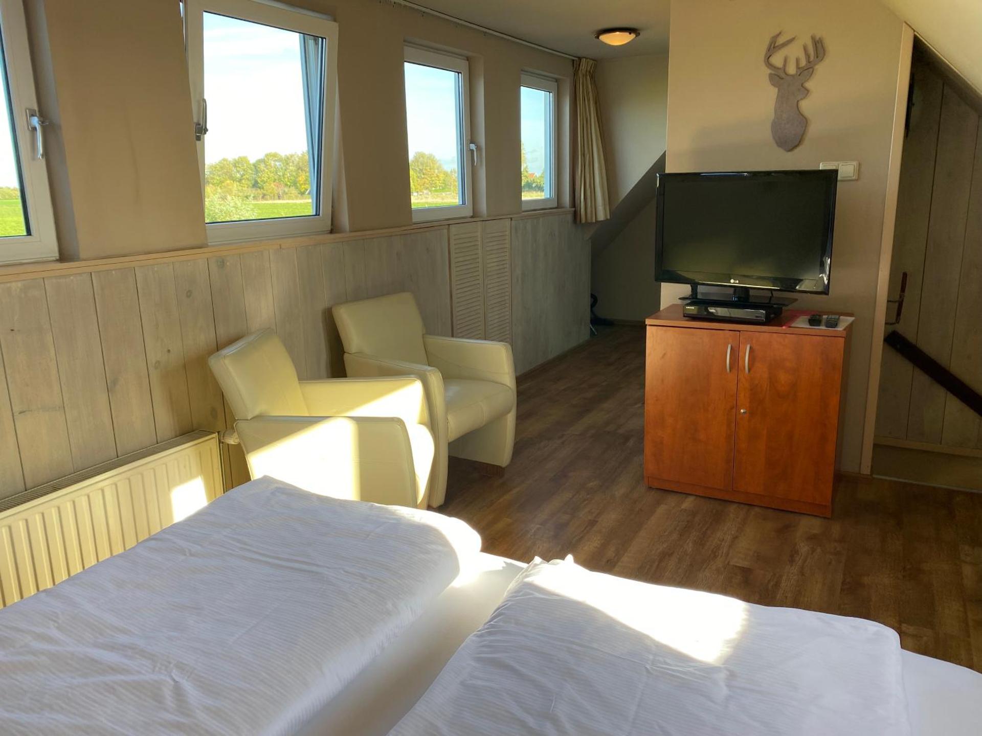 T Huuske tuinappartement met fantastisch uitzicht, nabij Zee