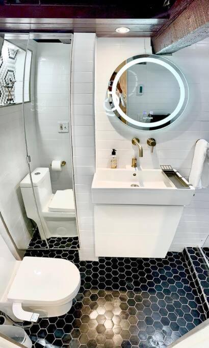 Live in this iconic East Side lower level unit