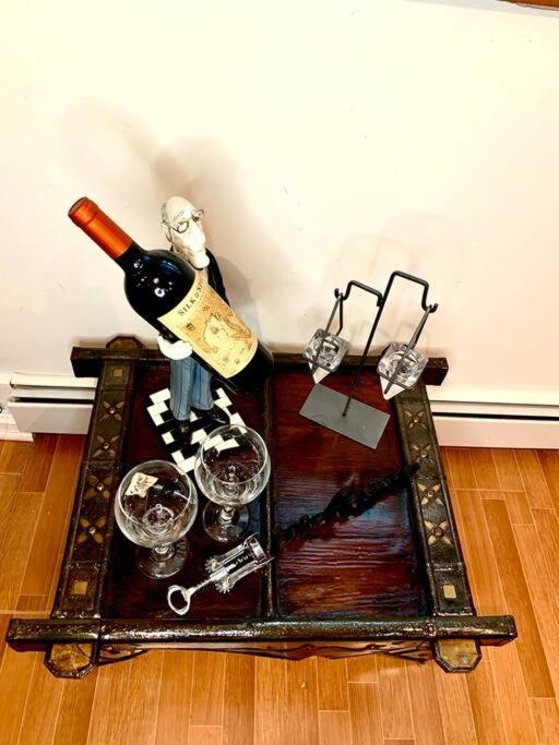 Live in this iconic East Side lower level unit