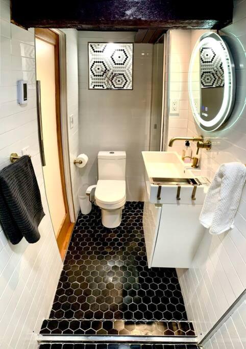 Live in this iconic East Side lower level unit