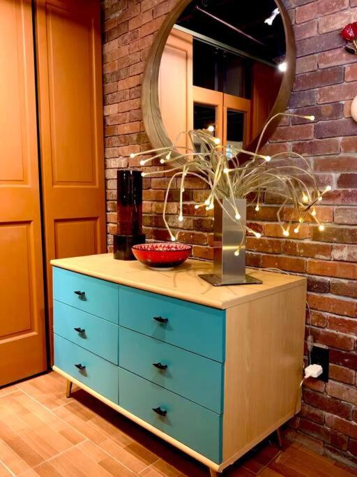 Live in this iconic East Side lower level unit