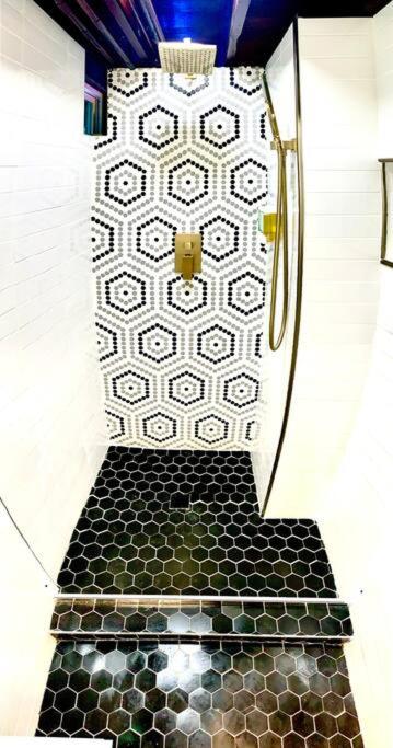 Live in this iconic East Side lower level unit