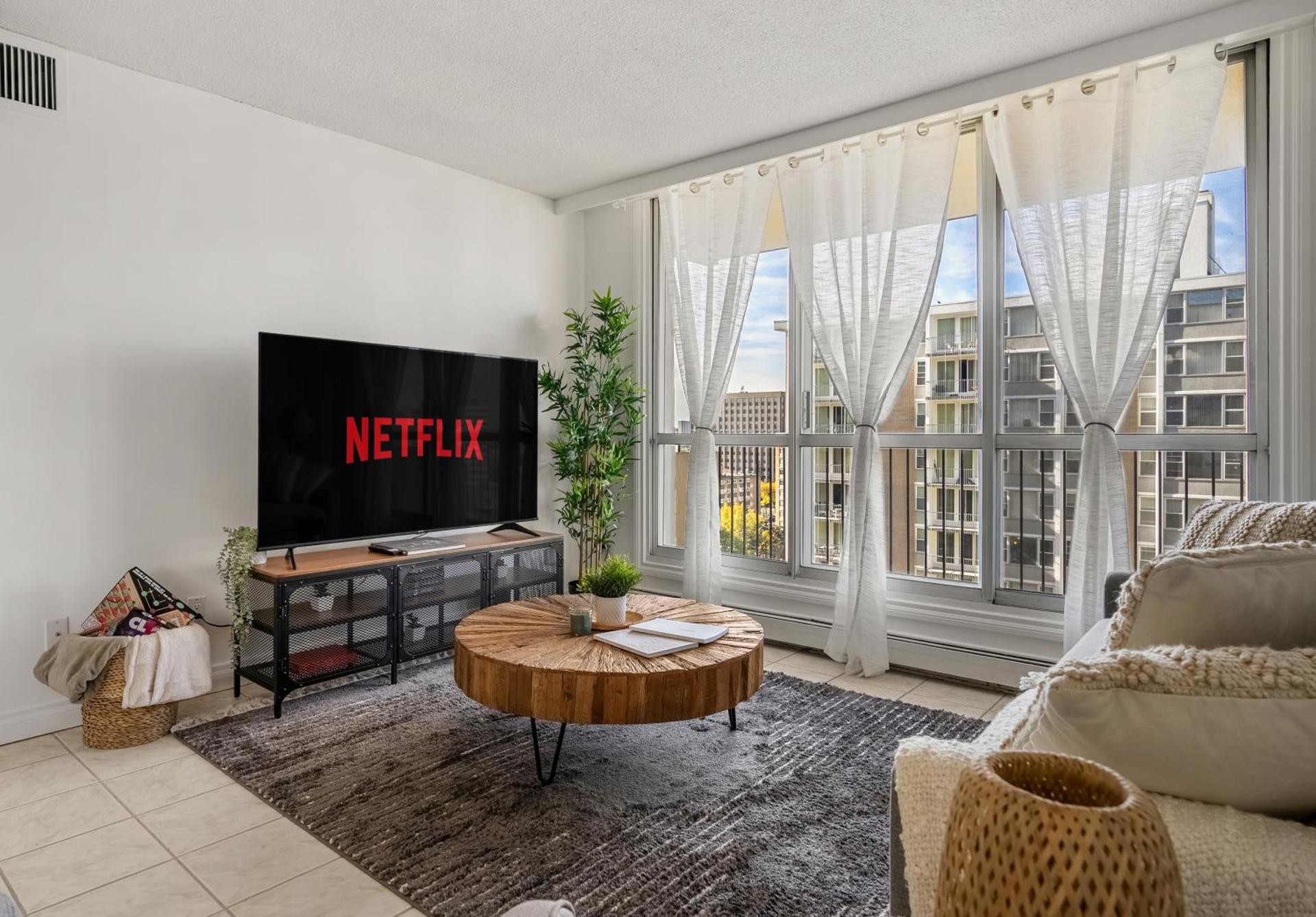 Downtown Near Rogers Place with Covered Parking, Sleeps 6, Pool Table, Sauna, Gym, Two Bedrooms & More