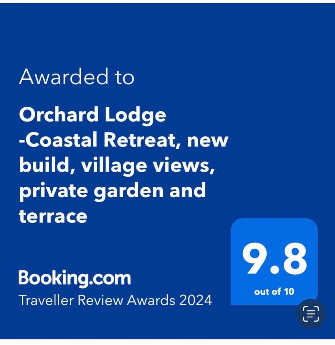 Orchard Lodge -Coastal Retreat, new build, village views, private garden and terrace