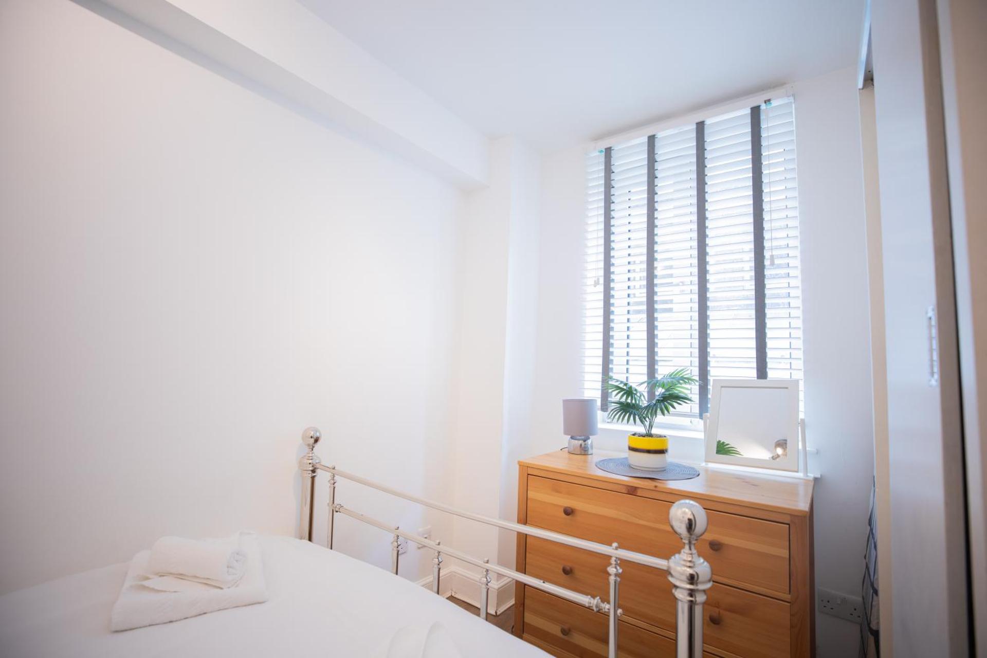 One bedroom at Chelsea cloister Hotel