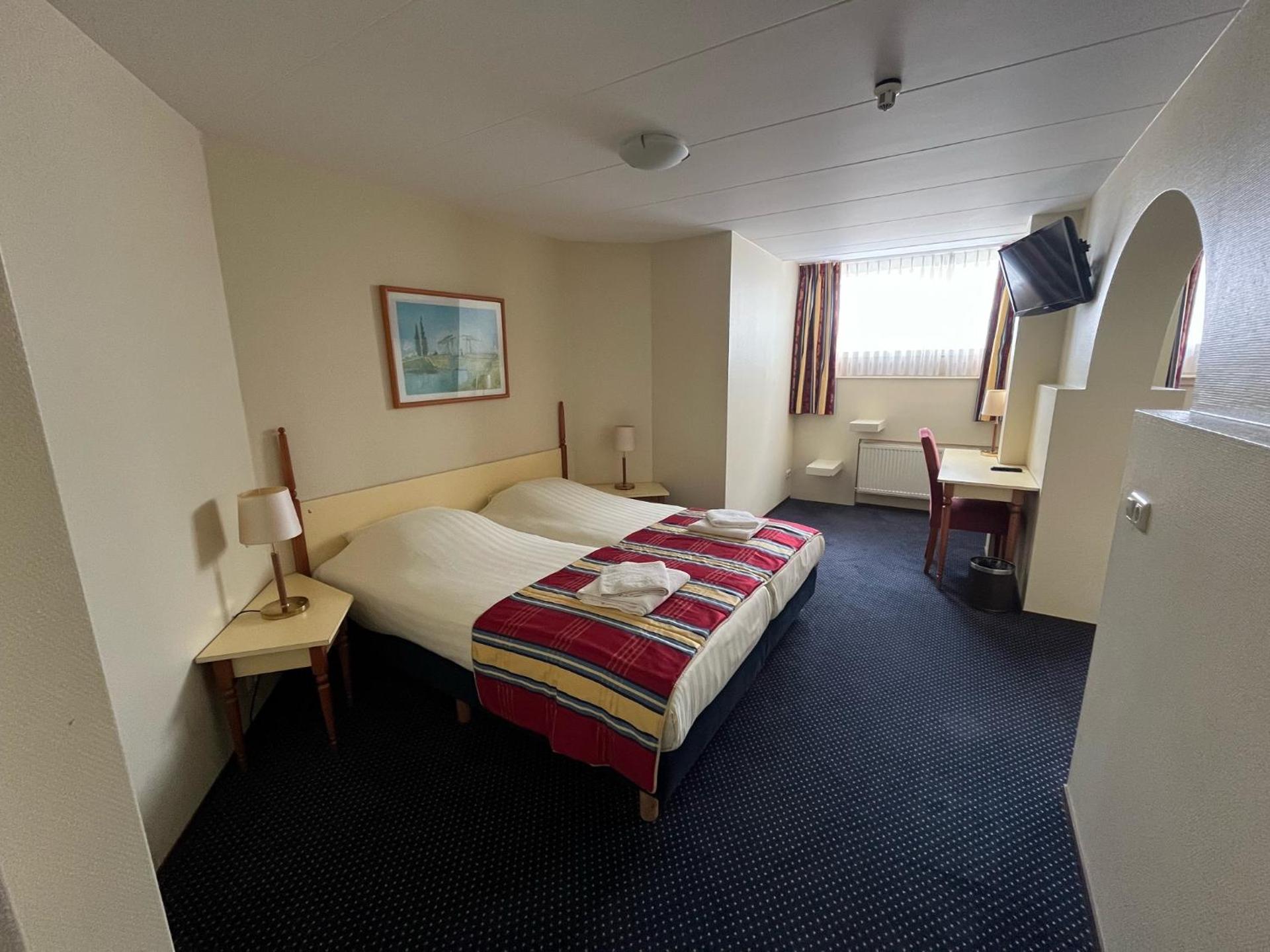 Standaard kamer met douche en extra bed in het souterrain