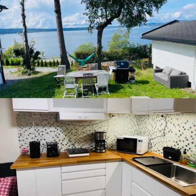 Nice Apartment with1 bedroom Separate living room with a sofa bed and a tiny kitchen a bathroom located in Nordstrand near by the Sea for 3 guests with a garden and grill with sea view just outside the apartment