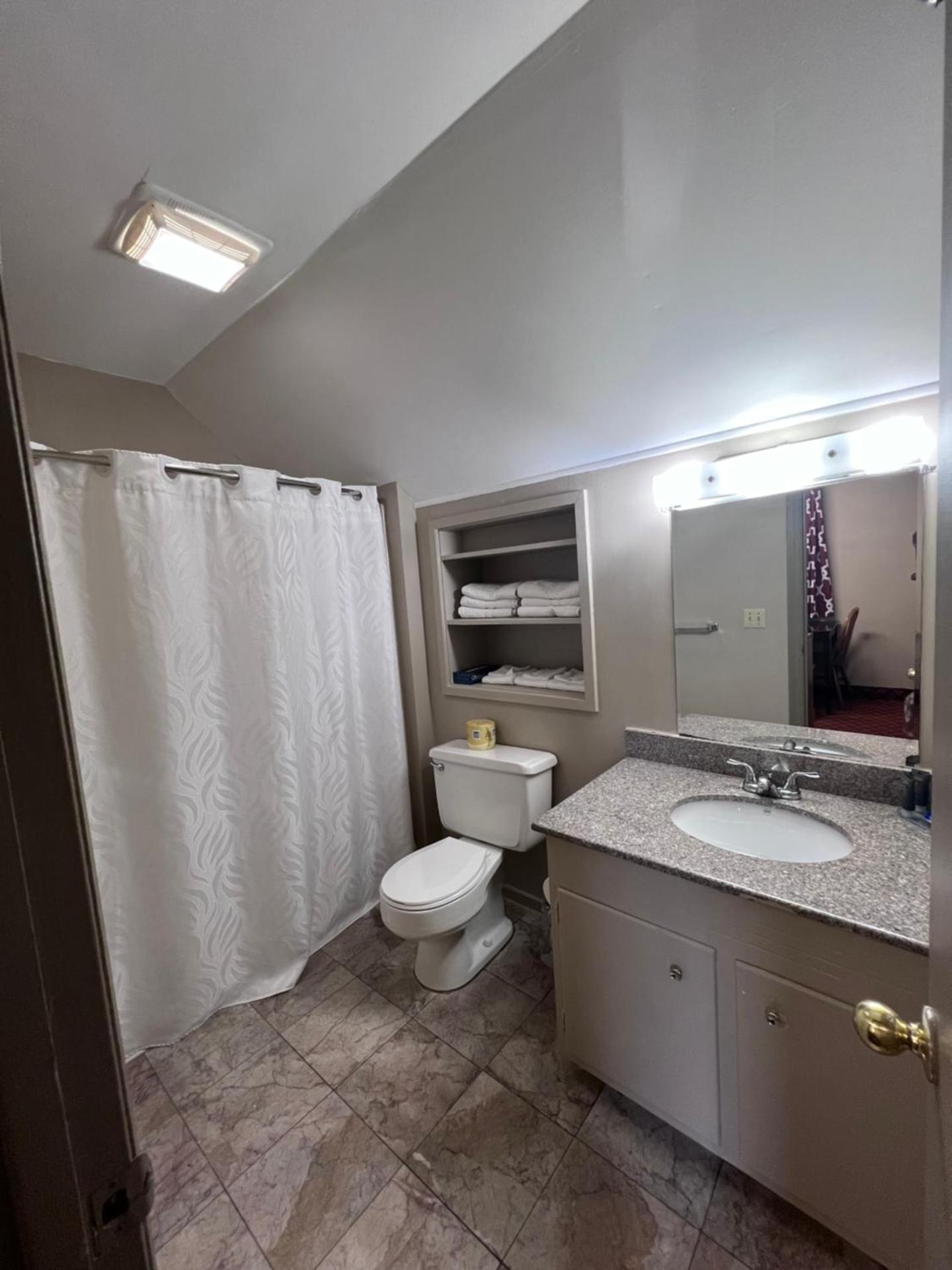 Queen Suite with One Queen Bed and Two Double Beds - Non Smoking