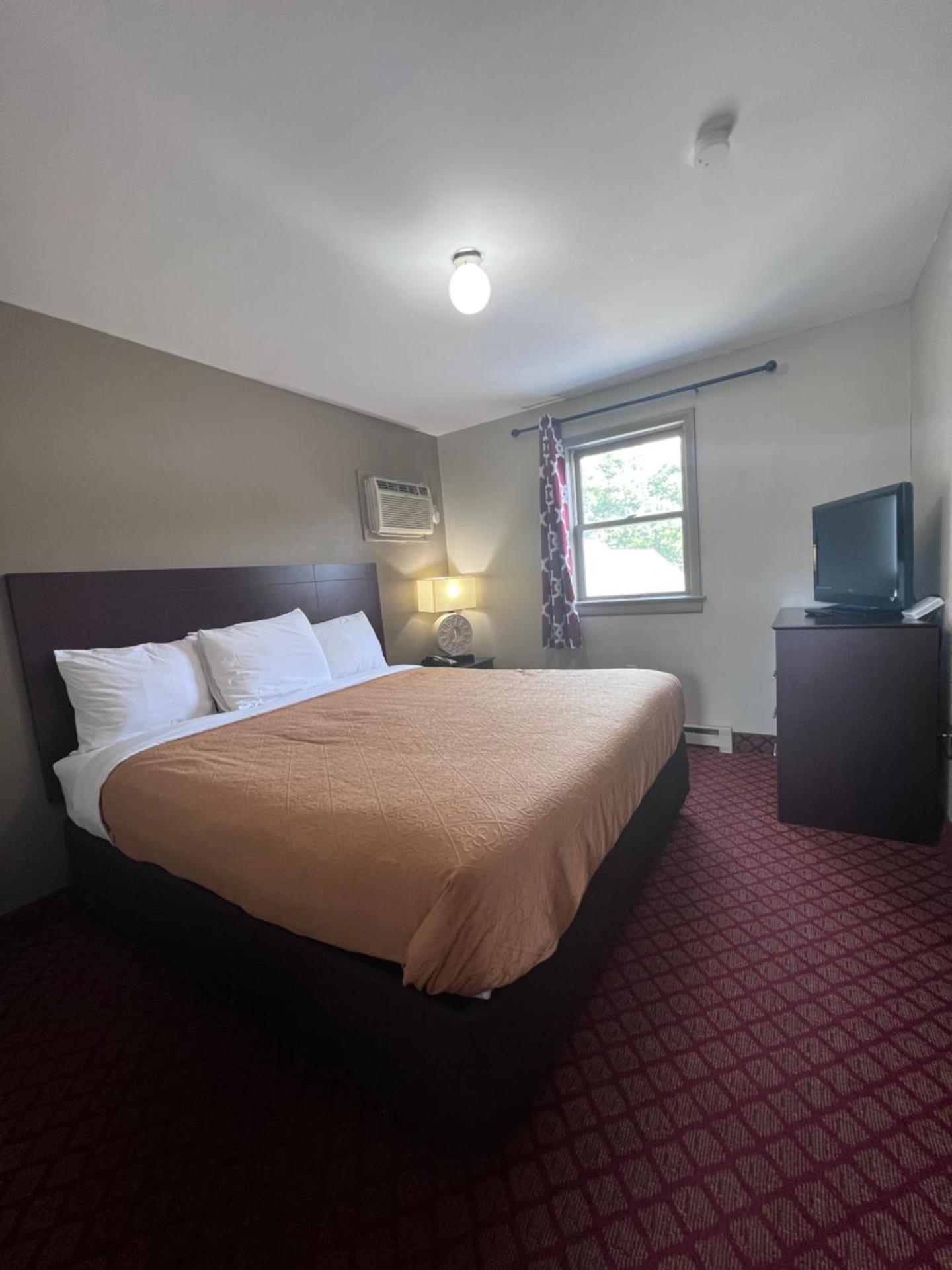 King Suite with One King Bed and Two Double Beds - Non Smoking