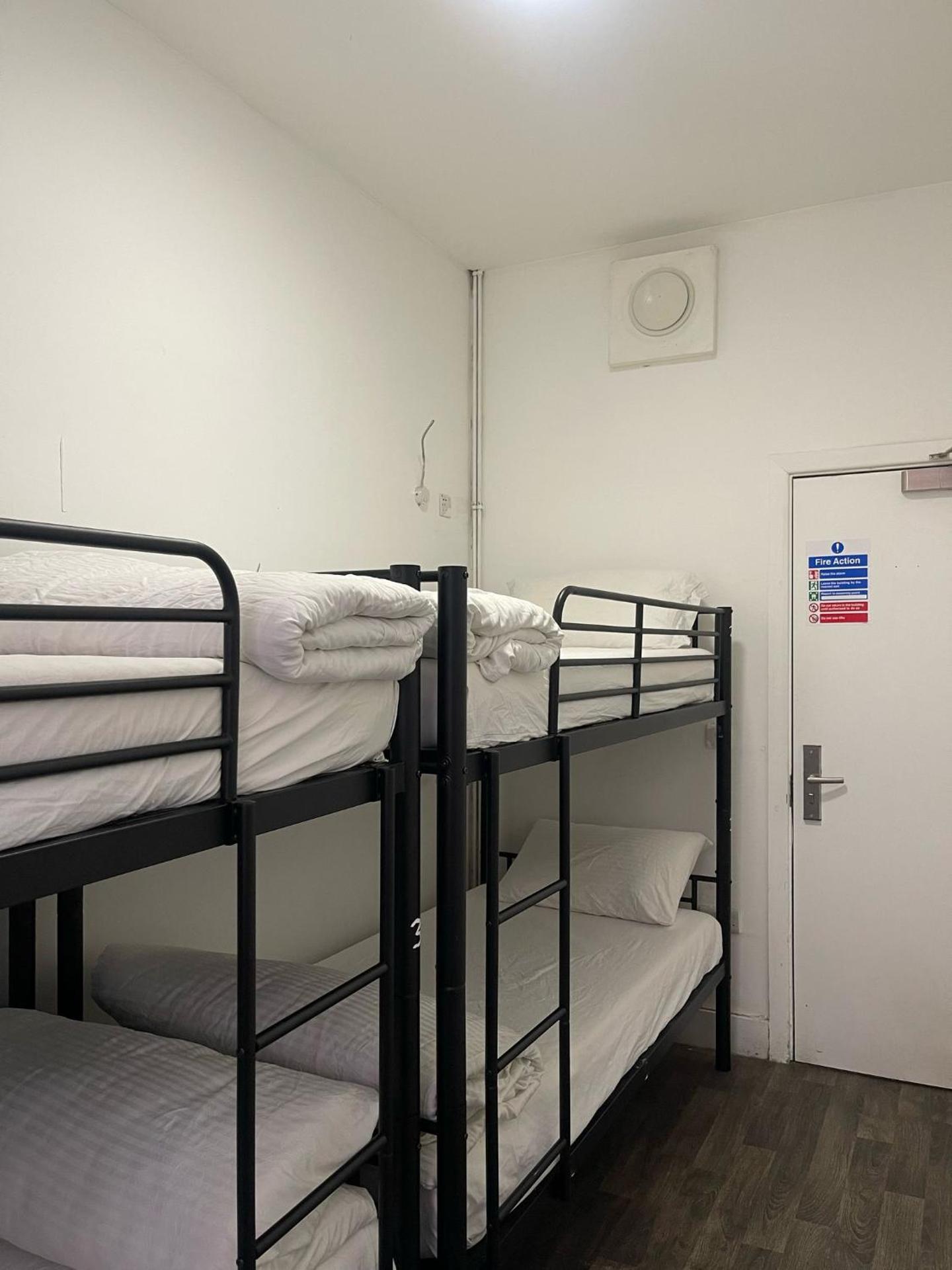 Bed in 14-bed Male Dormitory Room