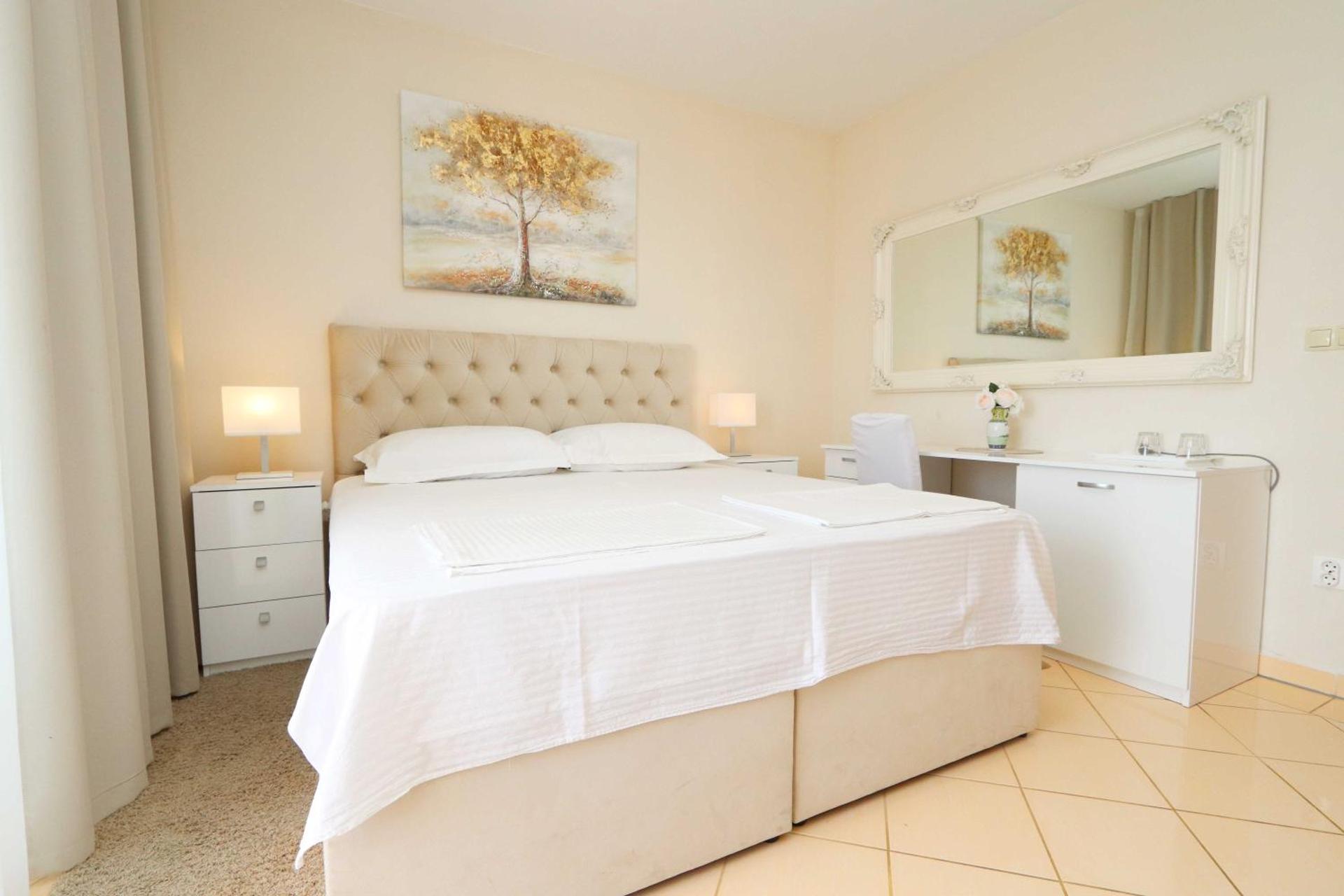 Two-Bedroom Suite with Balcony and Garden View