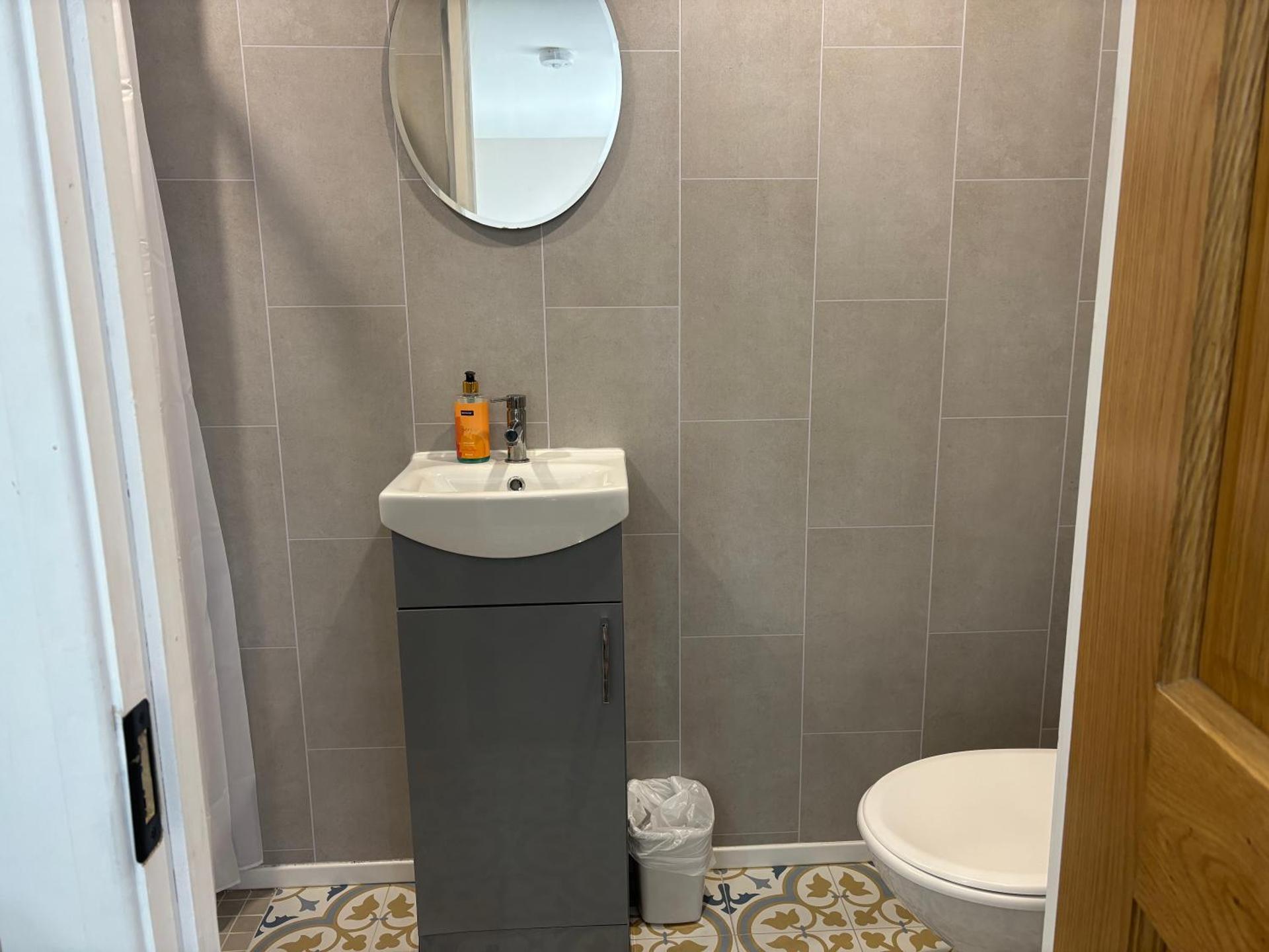 Private Detached Small Bedroom and Bathroom Only- This is not an apartment- No clothes storage- no cooking facilities