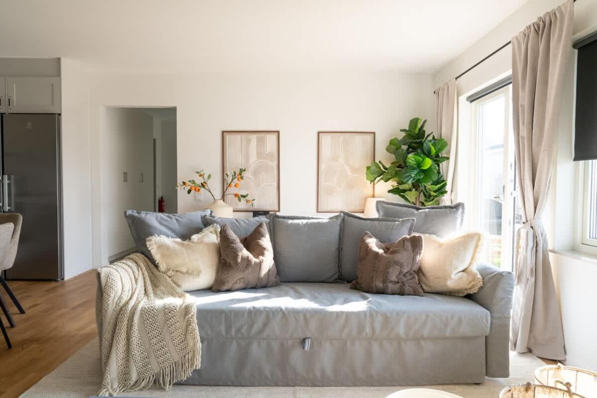 Earthy Ground Floor Home with Patio Sunbeds Greenery