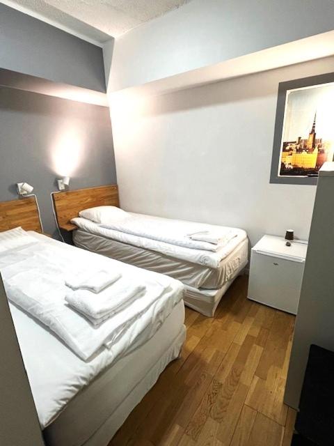 Twin Room with Shared Bathroom (No Window)