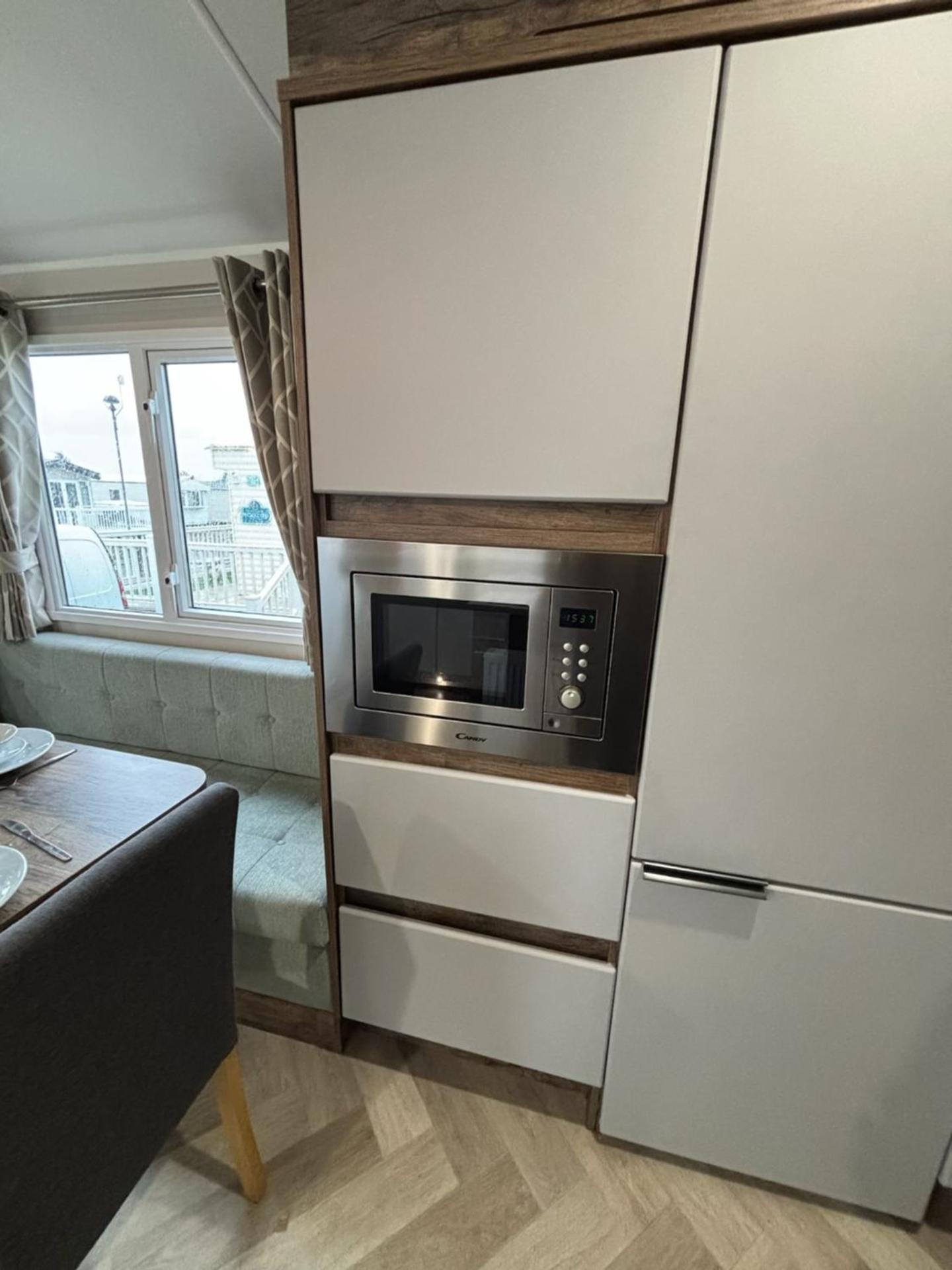 Luxury mini lodge with hot tub and decking at Tattershall Lakes