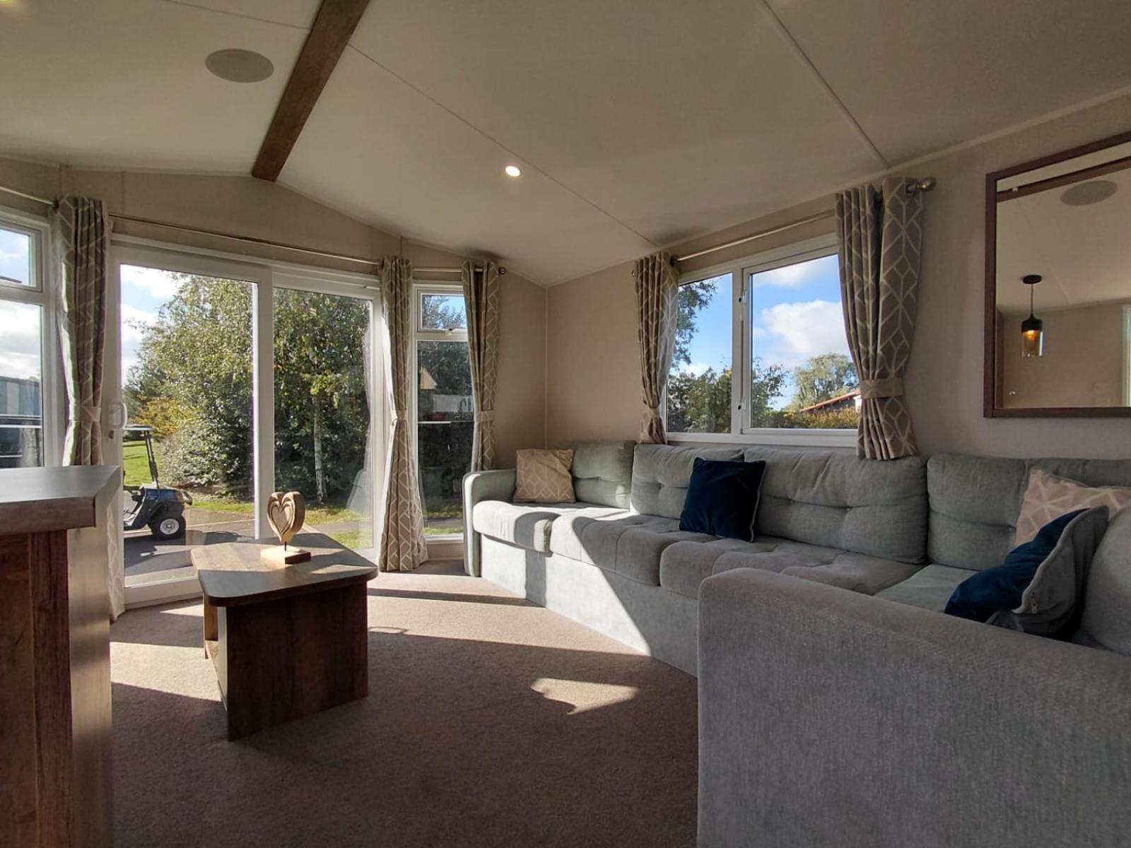 Luxury mini lodge with hot tub and decking at Tattershall Lakes