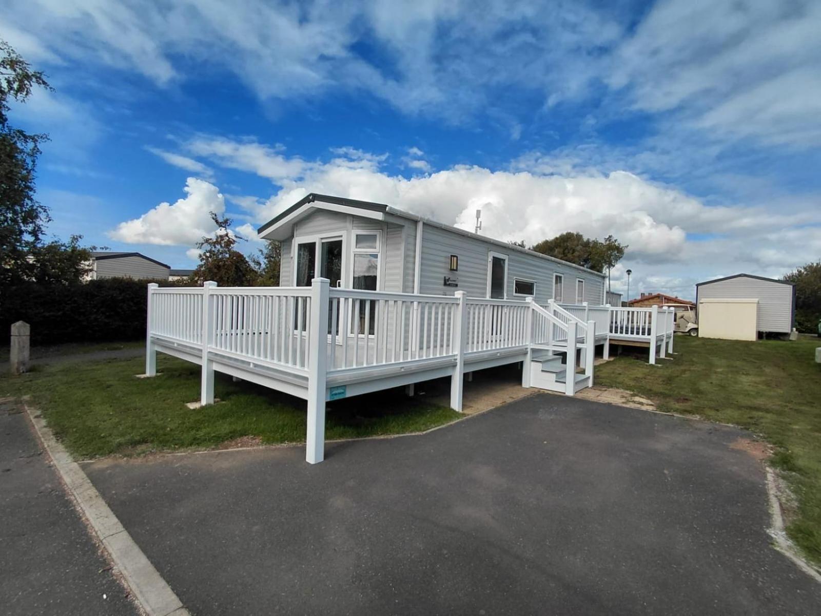 Luxury mini lodge with hot tub and decking at Tattershall Lakes