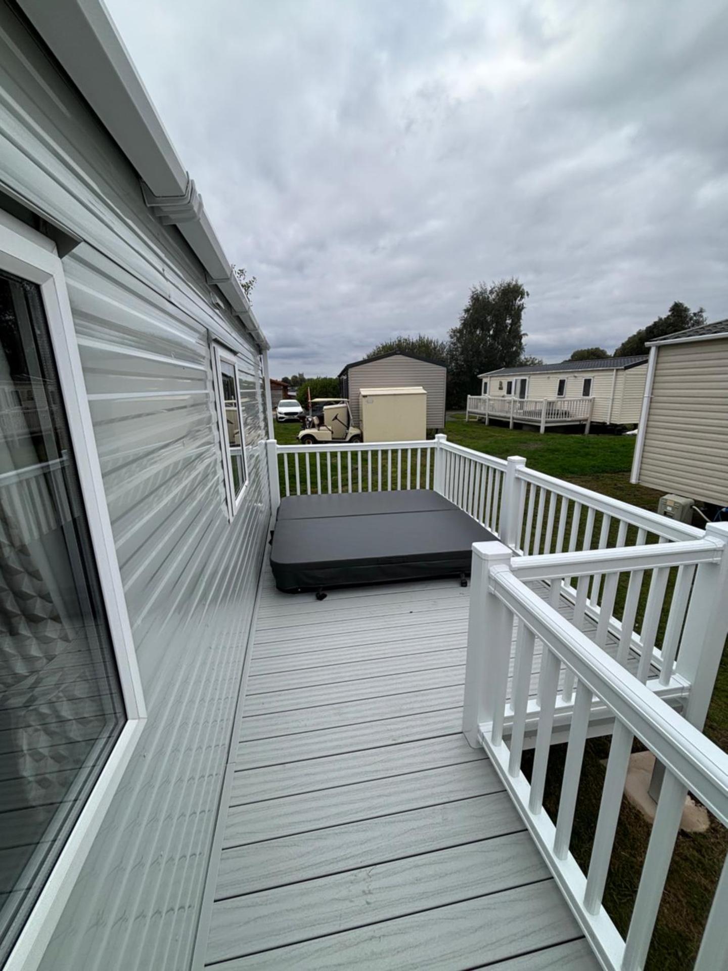 Luxury mini lodge with hot tub and decking at Tattershall Lakes