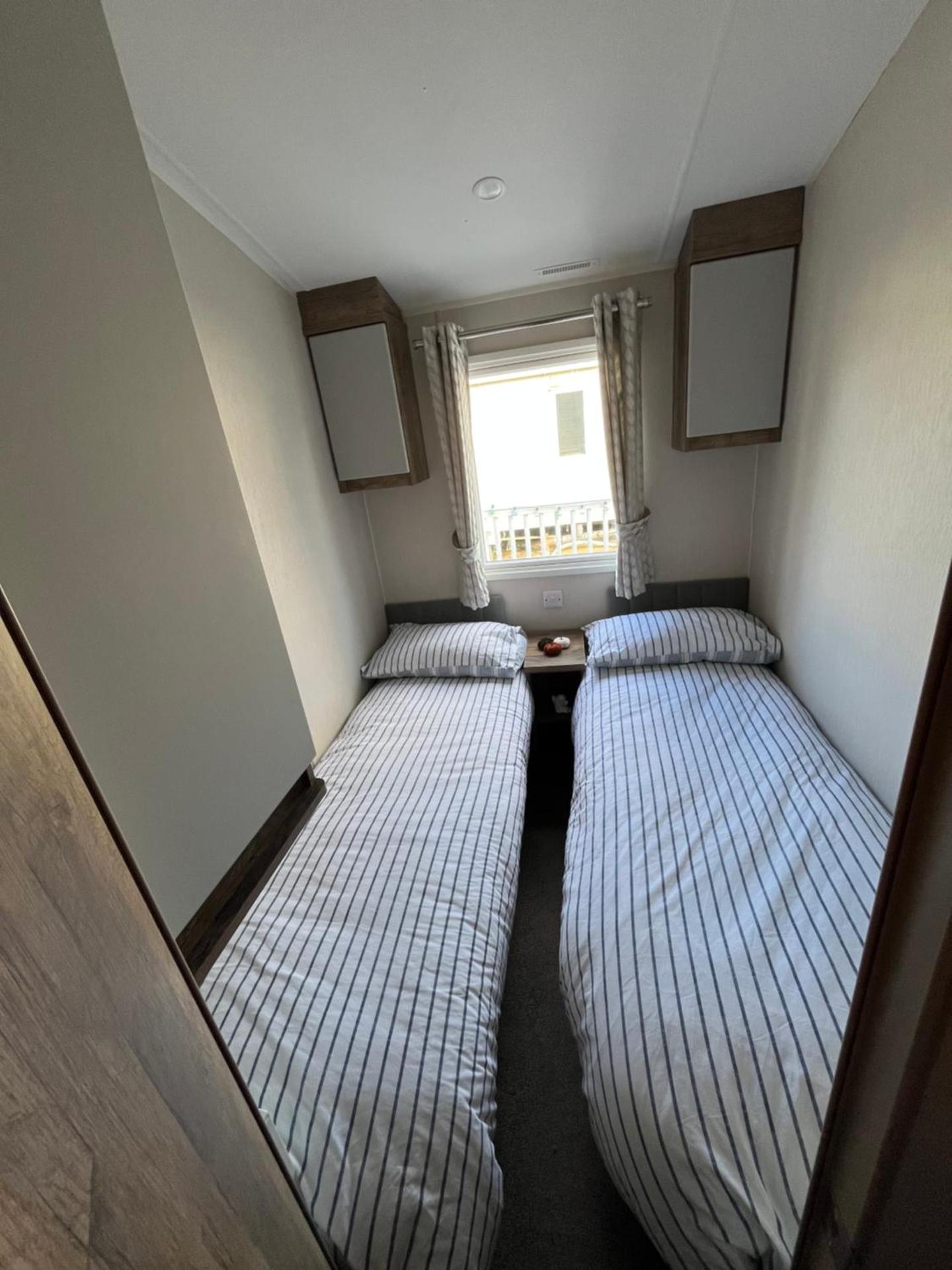 Luxury mini lodge with hot tub and decking at Tattershall Lakes