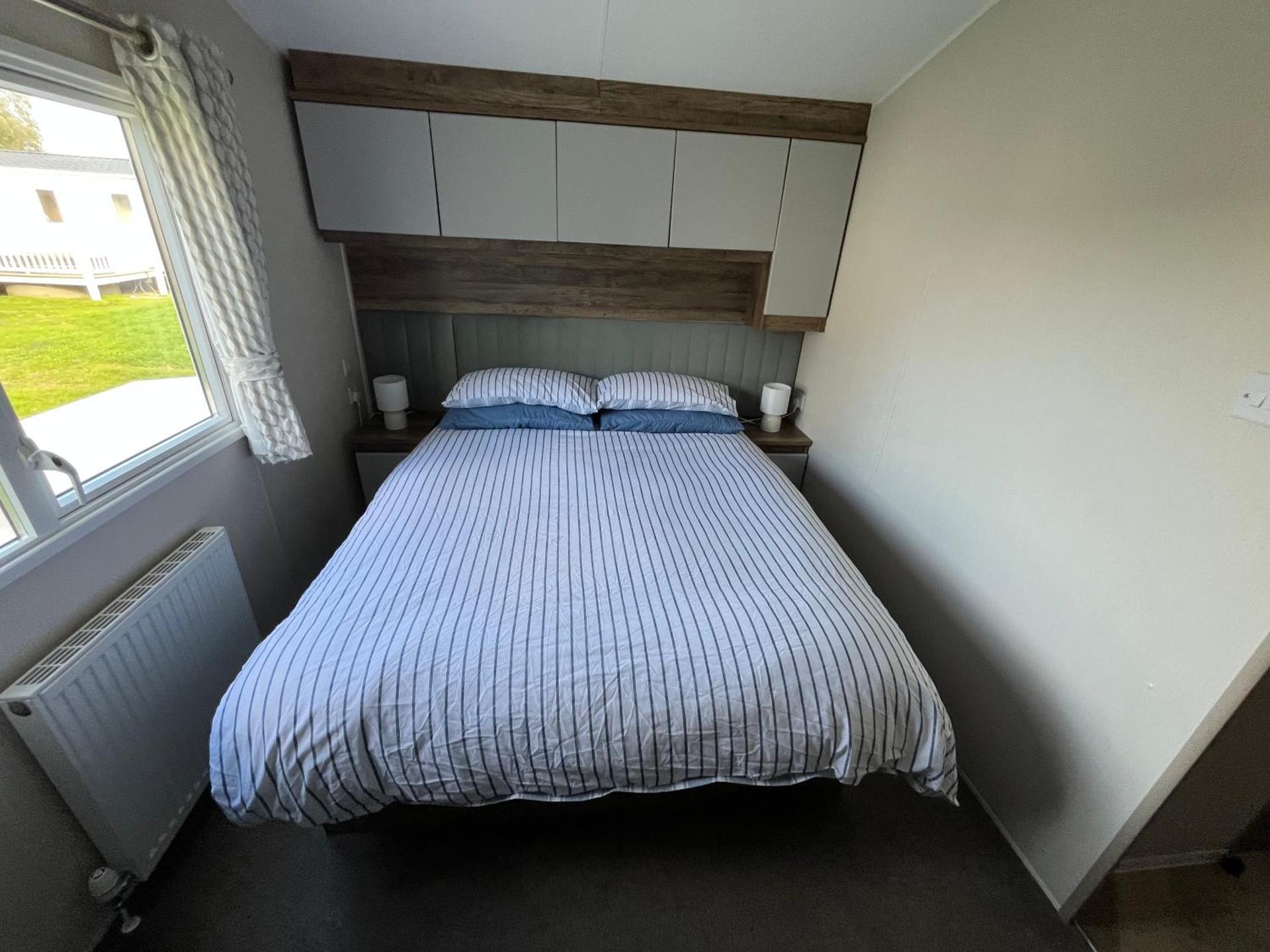 Luxury mini lodge with hot tub and decking at Tattershall Lakes