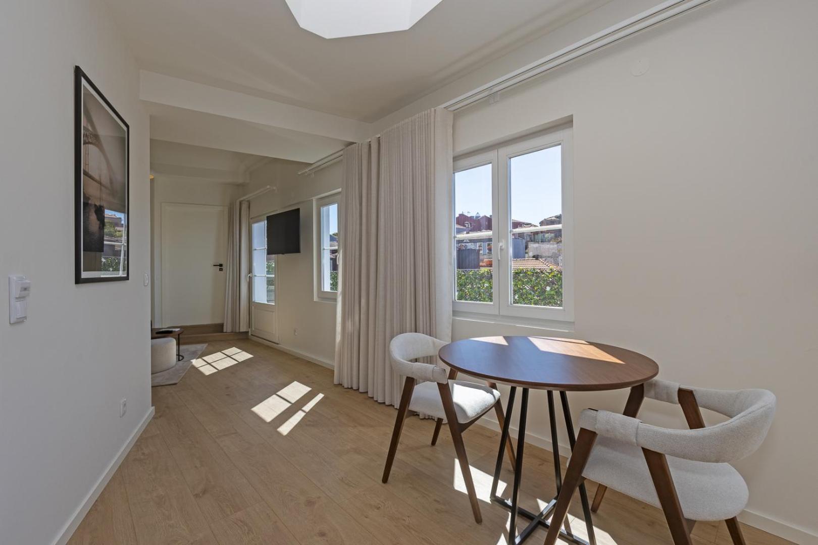 One-Bedroom Apartment with Balcony and City View