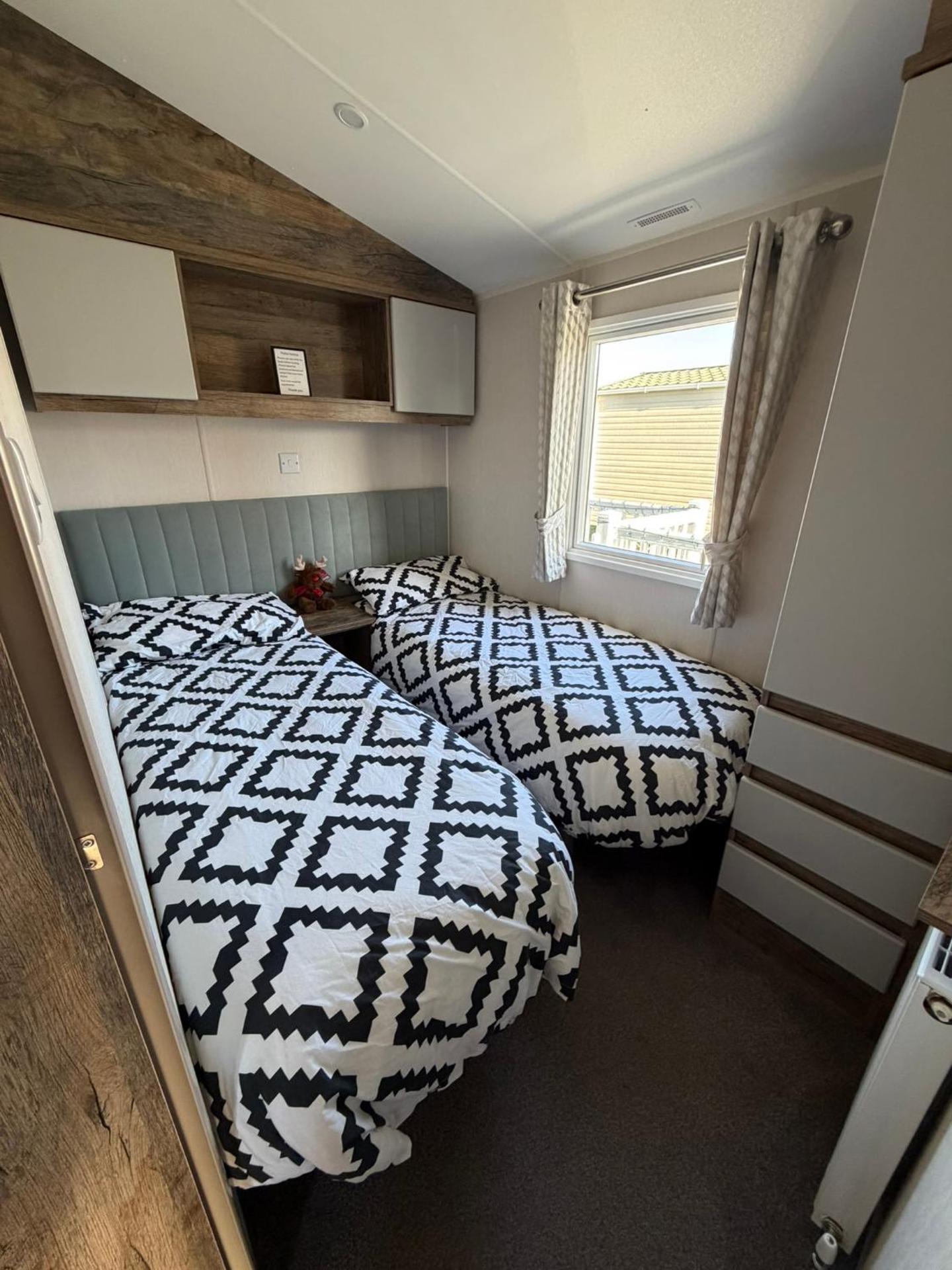 Luxury mini lodge with hot tub and decking at Tattershall Lakes