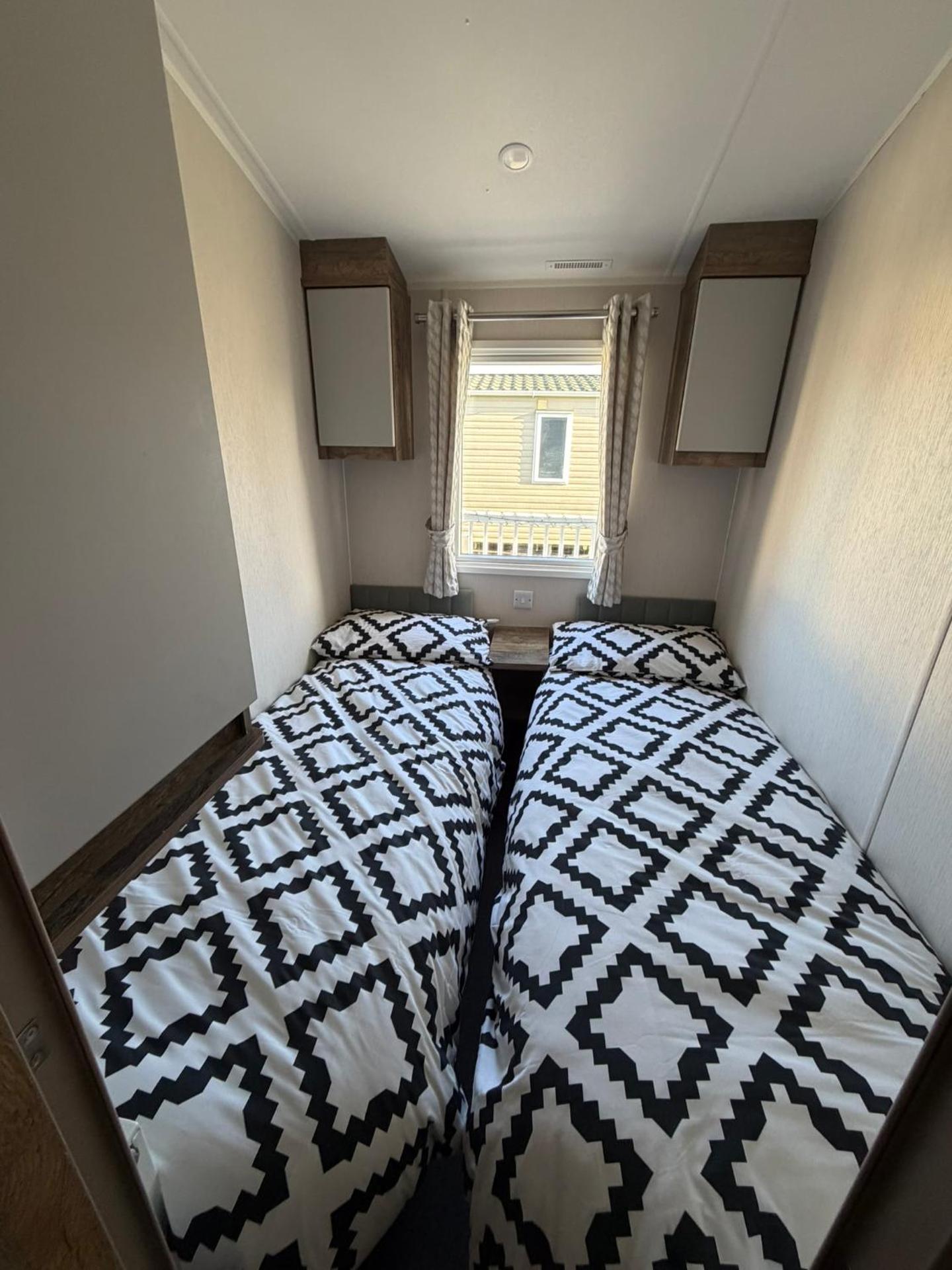 Luxury mini lodge with hot tub and decking at Tattershall Lakes