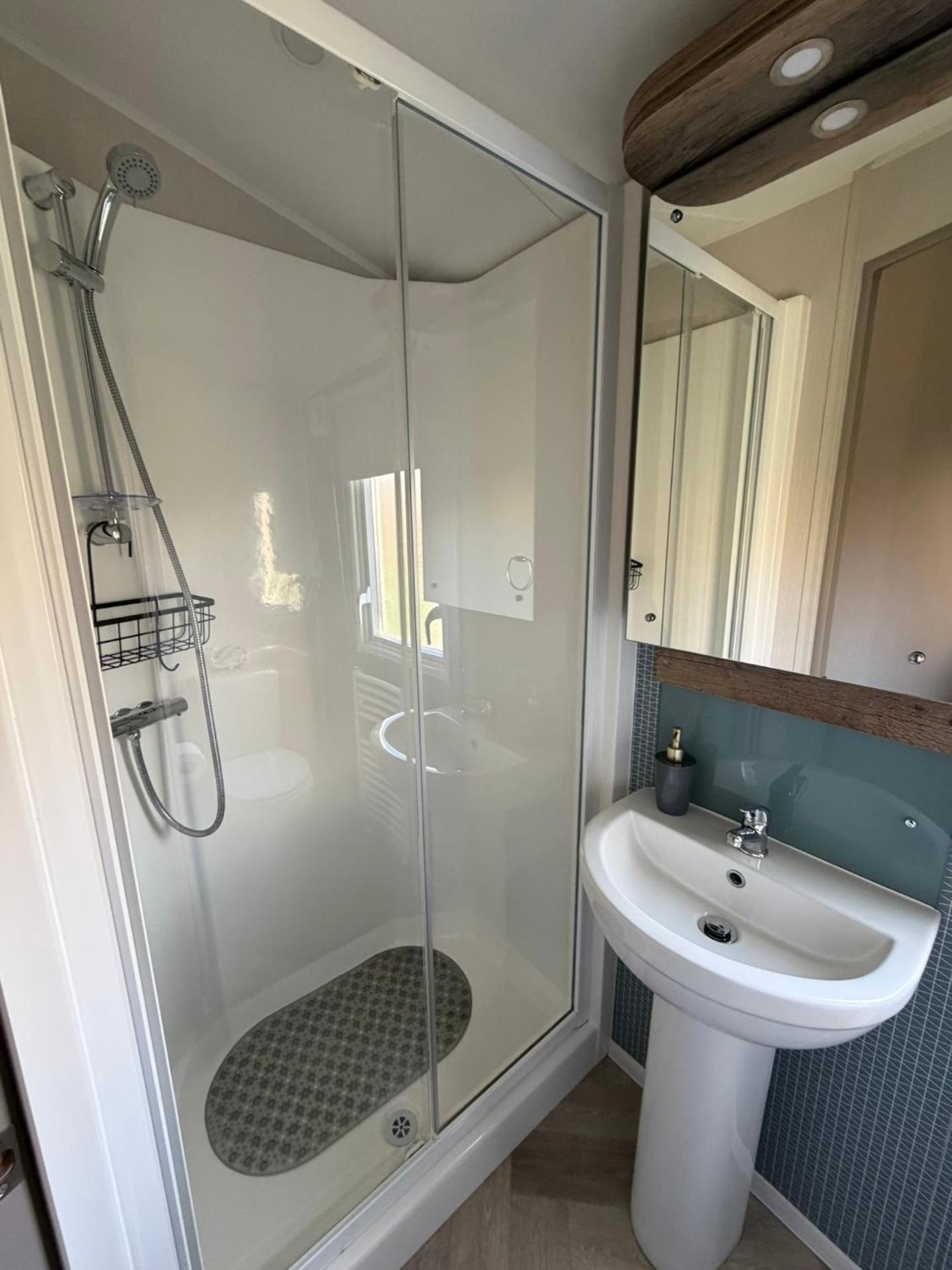 Luxury mini lodge with hot tub and decking at Tattershall Lakes