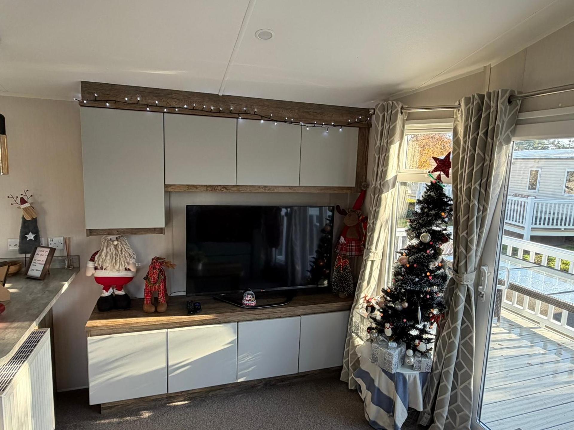 Luxury mini lodge with hot tub and decking at Tattershall Lakes