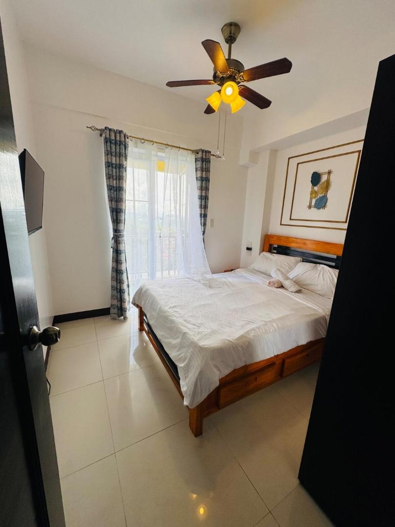 Фотография 7: 2BR with Veranda, Unli Netflix, Wifi