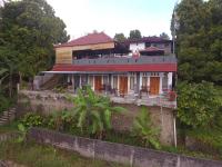 Adila Warung and Homestay - Chambres d’hôtes