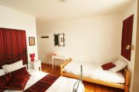 Camera Tripla con Vista Giardino