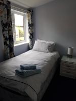 Camera Singola con Doccia e Servizi Igienici in Comune