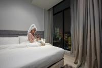  Deluxe Suite met Kingsize Bed en Uitzicht op de Petronas Twin Towers