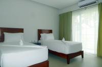 Camera Deluxe Doppia con Letti Singoli