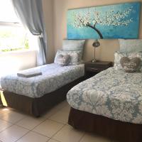 Tweepersoonskamer met 2 Aparte Bedden en Gedeelde Badkamer