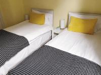 Budget Tweepersoonskamer met 2 Aparte Bedden en een Gedeelde Badkamer