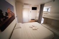 Camera Quadrupla Superior